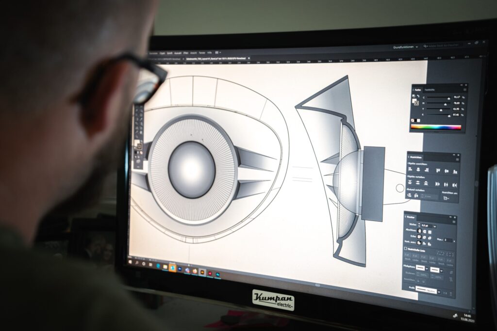 A man using CAD to create a digital twin of a product.